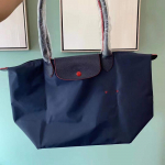 Uus disainkott nailonist naiste k&auml;ekotid logoga Dumpling Beach Bag Luksuslikud kaubam&auml;rgiga ostukotid nahast k&auml;epidemega kandekotid L 31cm