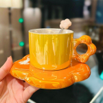 P&auml;rliga glasuuritud lilledega keraamiline kohvitass lusikaga Naiste kontori p&auml;rastl&otilde;unatee Ilus veetass oranž