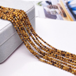 Tiigrisilma helmed Looduslikust kivist isoleerivad helmed 2/3/4/mm siledad helmed ehete valmistamiseks DIY k&otilde;rvar&otilde;ngad k&auml;ev&otilde;ru kaelakee tarvikud 4mm