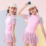 Tween Girls' Fashion Summer Beach 2-osaline bikiinide ujumisriiete komplekt, tr&uuml;kitud l&uuml;hikeste varrukatega &uuml;laosa ja seelikuga ujumistrikoo Laste kuumaveeallikas ujumiskost&uuml;&uuml;m Tankini 14 roosa