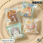 100 tk/partii plastikust koomiksik&uuml;psise- ja kommikotid Isekleepuv kinkekott pulmapeo tarvikute jaoks, k&uuml;psiste pakendikott B1