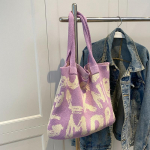 Kirjatr&uuml;kiga &otilde;lakott suure mahutavusega kontrastv&auml;rviga puuvillane kangas k&auml;sitsi kootud suvemoodne kootud k&auml;ekott 41x2x36cm must