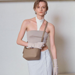 Pehme ja lohakas kandekott Moodne mitmek&uuml;lgne v&auml;lismaine nahk lit&scaron;imustriga &Uuml;he &otilde;la &uuml;le keha kaenlaalune kott naistele