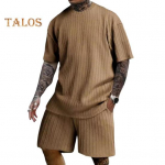 2 tk/komplekt Meeste spordi&uuml;likond O-kaelusega l&uuml;hikeste varrukatega T-s&auml;rk elastse v&ouml;&ouml;kohaga laia s&auml;&auml;rega taskutega l&uuml;hikesed p&uuml;ksid, komplekt žakaarv&auml;rvi tekstuuriga jooksur&otilde;ivad M valge