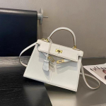 2025 Uue stiili Ehtne nahast Naiste kott &Uuml;lemine kiht Swifti nahk Retro pl&uuml;&uuml;sikott K&auml;eshoitav &Uuml;he &otilde;la kott Plahvatus 25CM valge