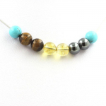 Pierres et Min&eacute;raux. Collier perles H&eacute;matite + Citrine + Oeil de Tigre + Turquoise 8 mm Chaine en acier inoxydable.