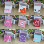 100 tk/komplekt Isekleepuvad j&otilde;uluvana tsellofaanipeo maiuspalad, kommide kinkekotid