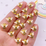 50 tk 10 mm vaiguga k&auml;sitsi maalitud mini mesilaste k&uuml;&uuml;ned, lameda seljaga multifilm Rhinestone DIY v&auml;ljal&otilde;igete album Aplikatsioonid Aksessuaarid K&auml;sit&ouml;&ouml;