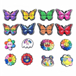 16 tk liblika ja armsa p&auml;evalille seeria PVC kingav&otilde;lusid kingade kaunistamiseks 16pcs