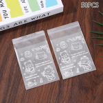 50 tk v&otilde;ikaru k&uuml;psise Opp isekleepuv kott kommid &scaron;okolaadid magustoidu isetihenduv kott kinkekott kaardi hoiukott valge