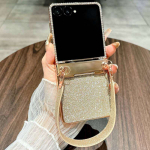 Klapiga &uuml;mbris Samsung Galaxy Z Flip7/ 6/ 5/ 4/ 3 jaoks, liigendi kaitse ja randmepaela kinnitusega, telefoni p&otilde;rutussummutid Samsung Z Flip5 kuld