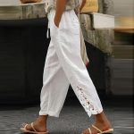 Naiste vabaaja &uuml;hev&auml;rvilised pitsiga &uuml;hendatud disainiga k&otilde;rge v&ouml;&ouml;kohaga n&ouml;&ouml;riga taskutega &uuml;heksa minuti pikkused p&uuml;ksid L must