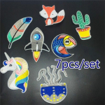 7 tk / komplekt koomiksikujulisi triigitavaid plaastreid laste riietele loomakujuliste kujunditega 7pcs