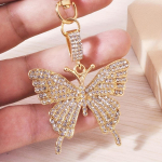 1tk l&auml;ikiv Rhinestone Butterfly v&otilde;tmehoidja armas loomasulamist v&otilde;tmehoidja r&otilde;ngas kott seljakott Charm auto v&otilde;tme ripats k&otilde;rvaklappide &uuml;mbris kuld