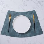 &Uuml;mmargune lehvikukujuline PU-asjamatt hiina/l&auml;&auml;ne lauale &ndash; p&otilde;hjamaise stiiliga veekindel isolatsioonipadi kodu- ja restoranilaudadele. sinine