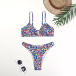 Naiste ujumistrikoo jagatud kaheosaline komplekt k&otilde;rge v&ouml;&ouml;kohaga varrukateta sises&auml;rgi n&ouml;&ouml;riga tr&uuml;kitud bikiini&uuml;likonnad L sinine