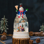 J&otilde;ulude lumekuuldekoratsioon muusikalatern siseruumide lauale Snowman