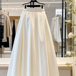 Temperamentsed pikad seelikud naistele Lihtsad k&otilde;rge v&ouml;&ouml;kohaga suure lehviga plisseeritud seelikud Moodsad A-l&otilde;ikelised seelikud XS valge