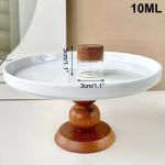 Kohvioa klaastoru puidust t&ouml;&ouml;riistaga, pudeldatud tuubid teravilja hoiustamiseks, puidust suletavad &otilde;hukindlad purgid S