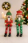 J&otilde;ulufiguuri serva p&auml;hklipureja komplekt 2 21 cm dekoratiivset figuuri kuju Dekoratiivsed meessoost j&otilde;uluvana figuurid Terrakotast, punane/roheline koos glitteriga - klassikaline j&otilde;ulukaunistus