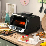 &Otilde;hufrit&uuml;&uuml;ri koos grilli, tarvikute ja retseptiraamatuga InnovaGoods Fryinn 12-in-1 6000 Must Teras 3400 W 6 L