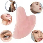 Roosa kvartsiga Gua Sha n&auml;omassaažimasin