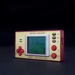 M&auml;ngukonsool Mad Monkey Spielkonsole 1,8" LCD Arcade 153 Spiele beige