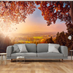 Fototapeet Artgeist Autumn delight - sunny landscape with countryside surrounded by trees and fields, 70 cm x 100 cm